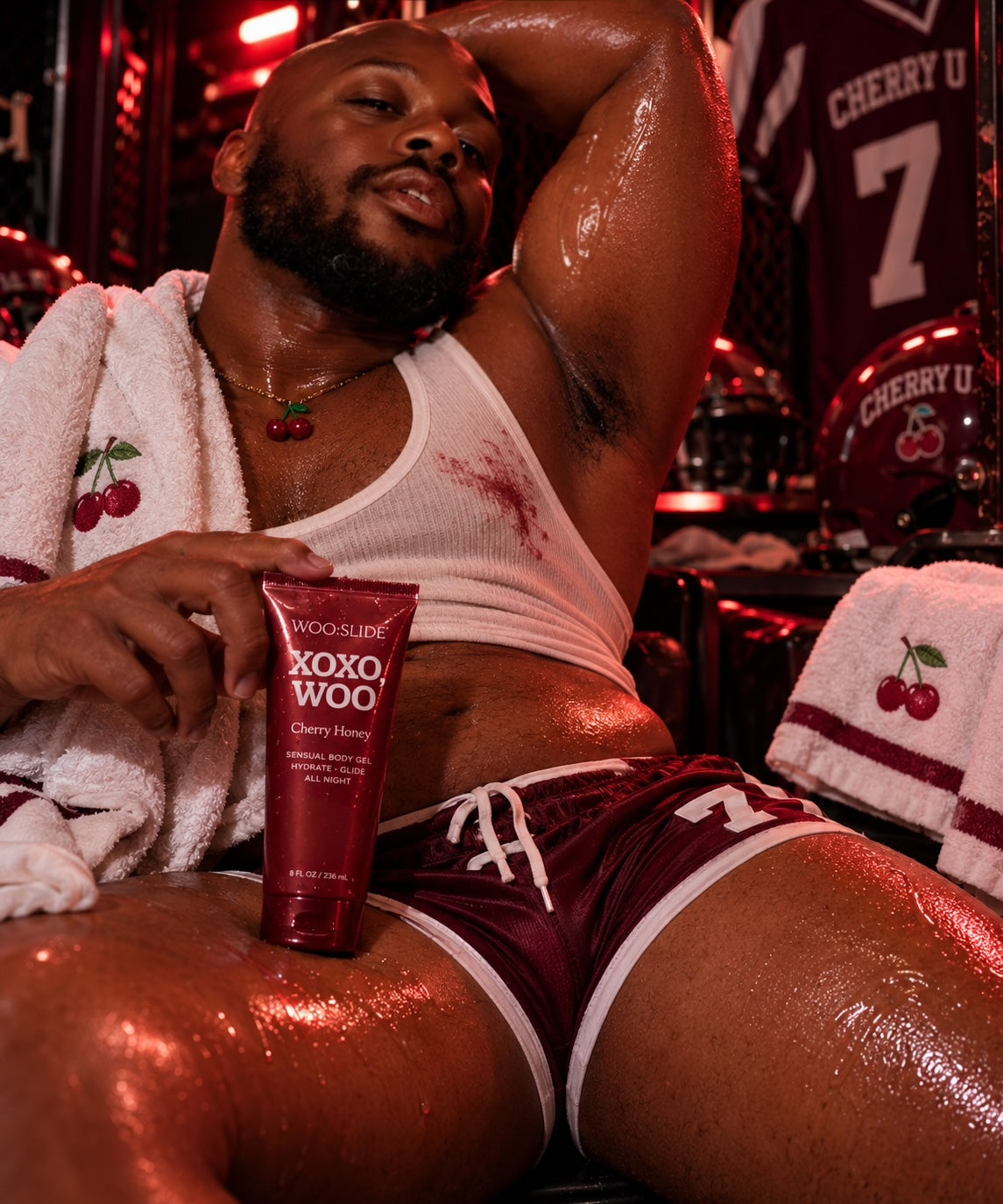 Carmine Davis holding WOO:SLIDE Cherry Honey in the Cherry U locker room