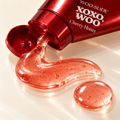 Close-up texture detail of translucent pink WOO:SLIDE Cherry Honey lubricant